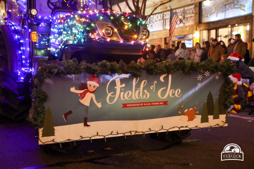 Fields of Ice parade float decorated with lights, presented by R.A.M. Farms