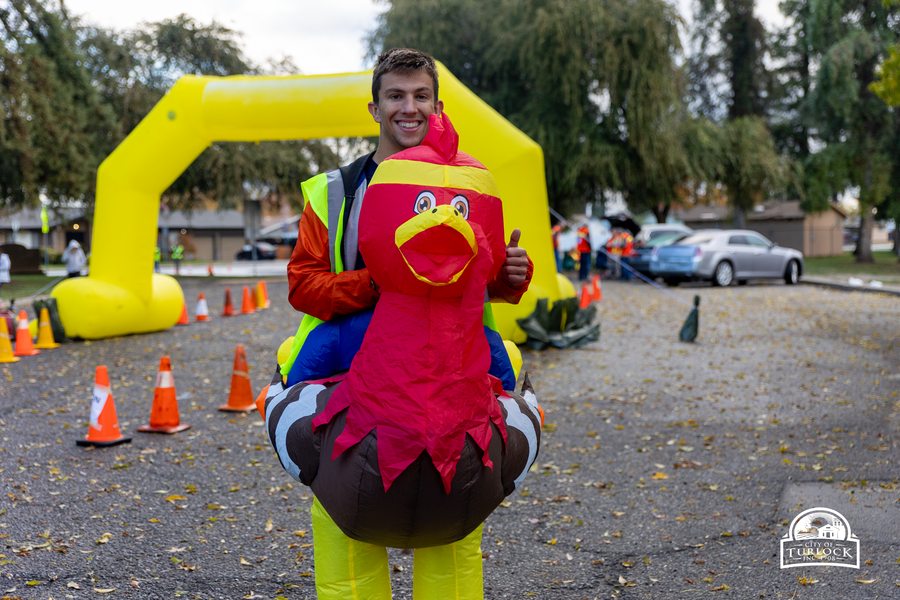 Runner in turkey costume at the starting line of the Turkey Trot